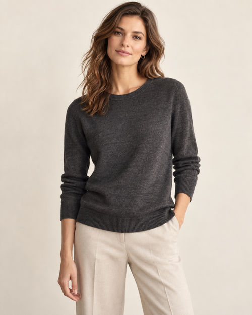 Woman wearing Maison Elin classic crewneck sweater in charcoal