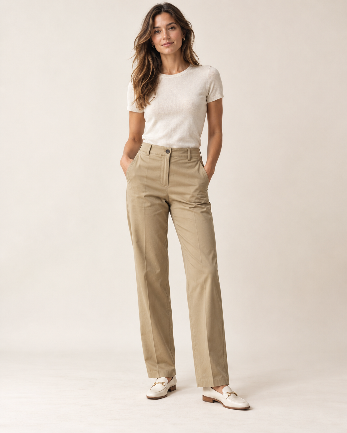 Woman wearing Maison Elin tailored chino trousers in sand